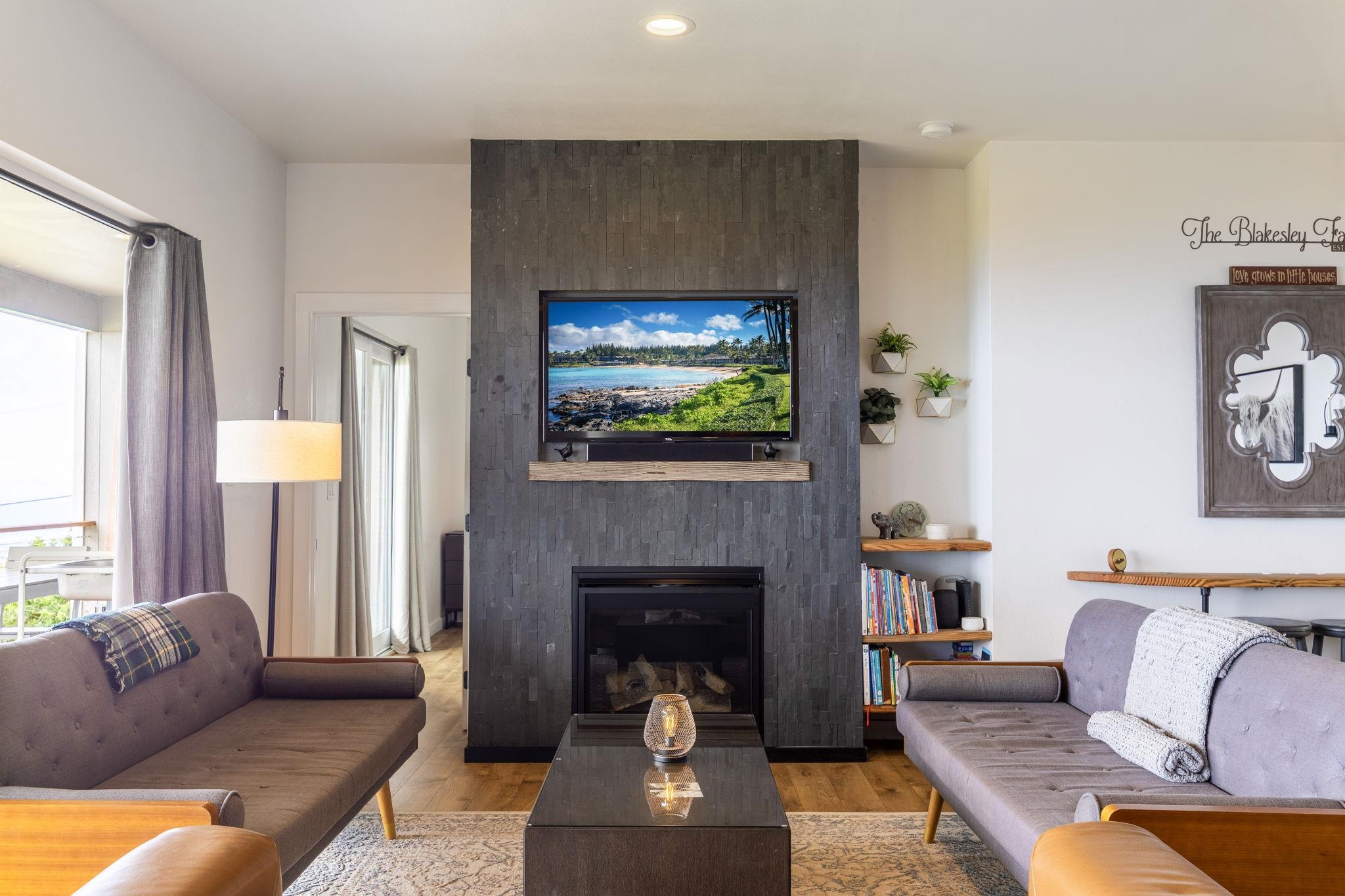 59 Waipoli Road Kula, HI 96790 - Photo 16 of 47 a living room with furniture and a fireplace