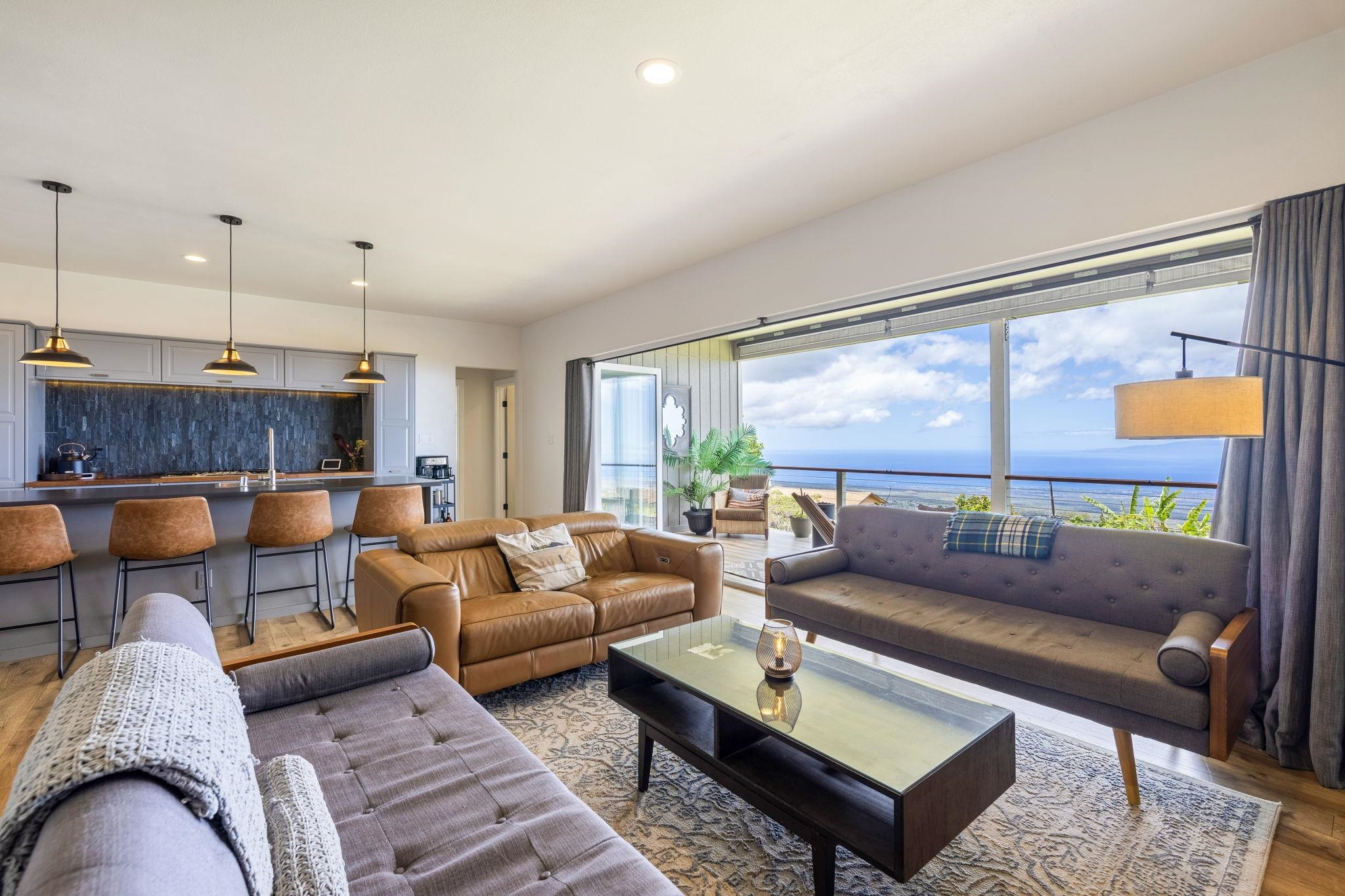 59 Waipoli Road Kula, HI 96790 - Photo 17 of 47 a living room with furniture and a large window