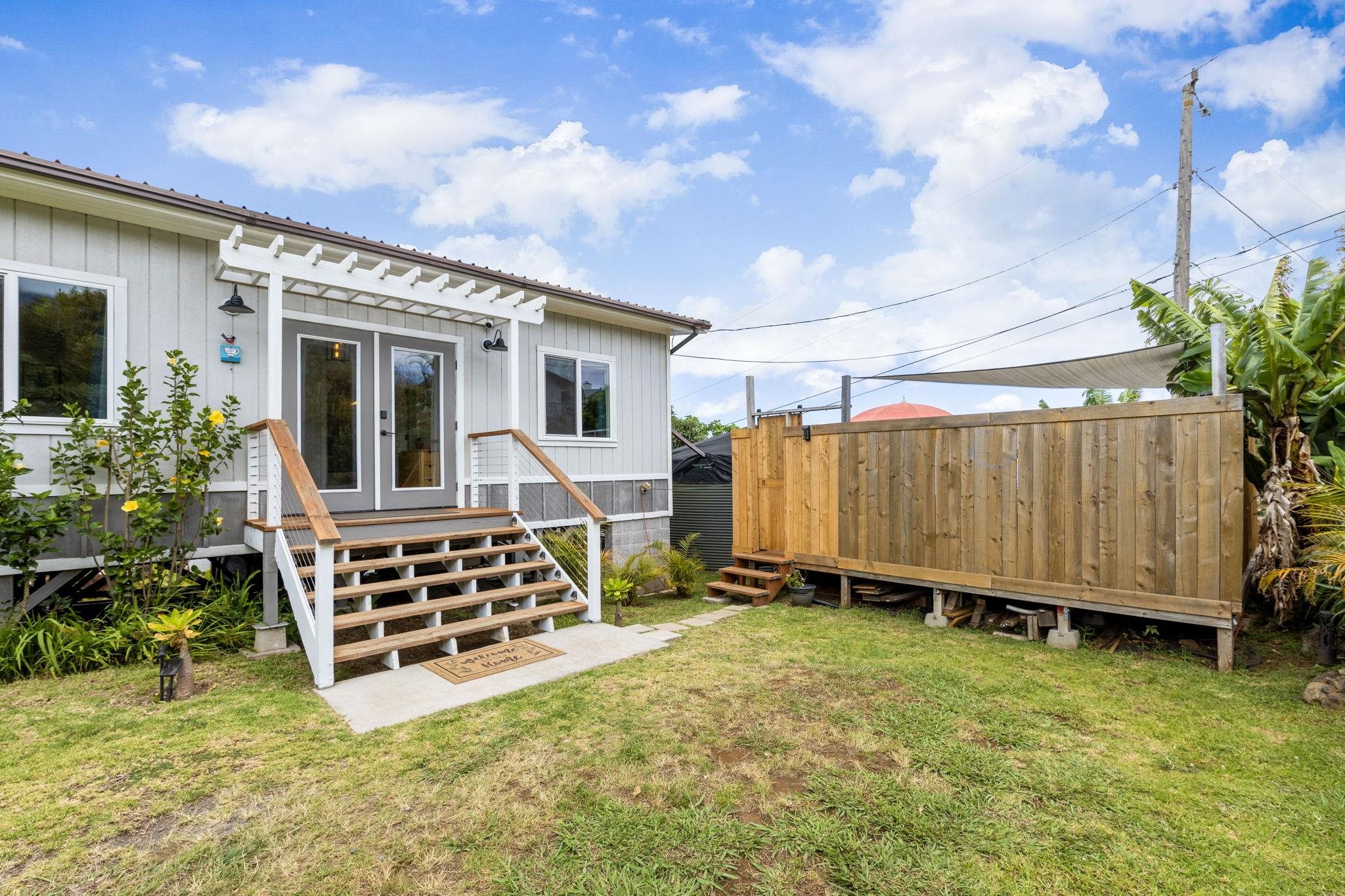 59 Waipoli Road Kula, HI 96790 - Photo 34 of 47 a view of a house with backyard and deck