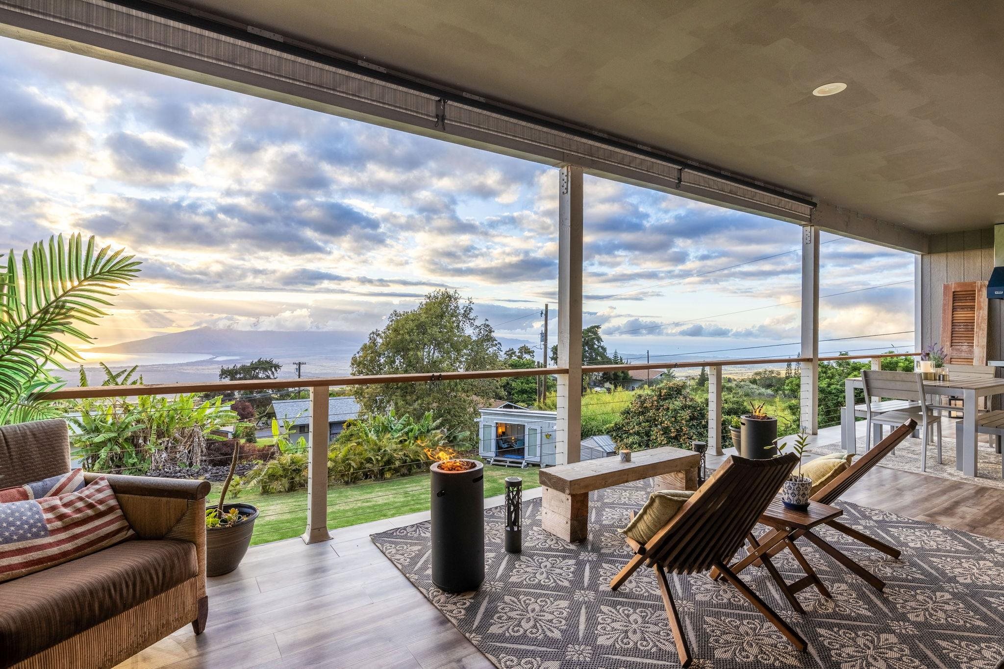 59 Waipoli Road Kula, HI 96790 - Photo 5 of 47 a view of a chairs and table in patio with a lake view