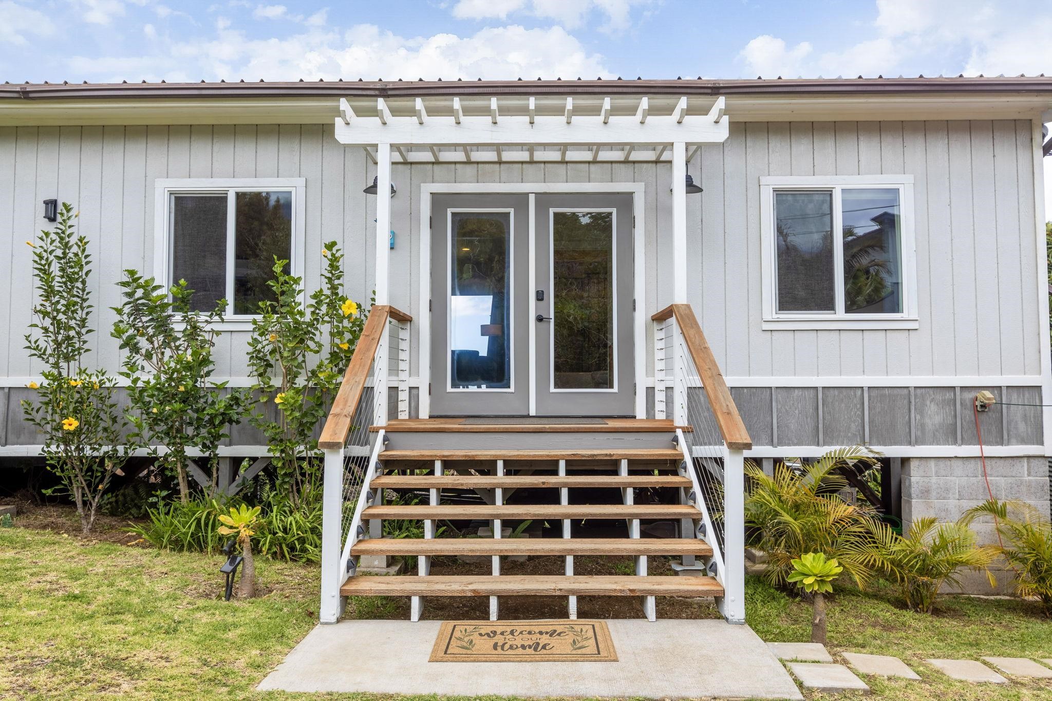 59 Waipoli Road Kula, HI 96790 - Photo 6 of 47 a front view of a house with a garden
