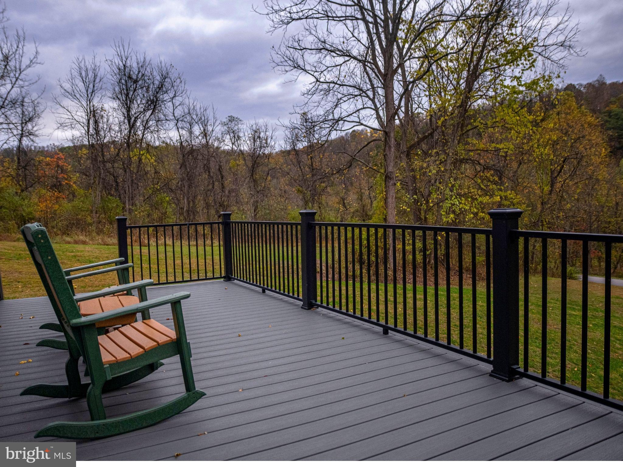 12076 Point Road Huntingdon, PA 16652 - Photo 5 of 13 a view of a wooden deck with a bench