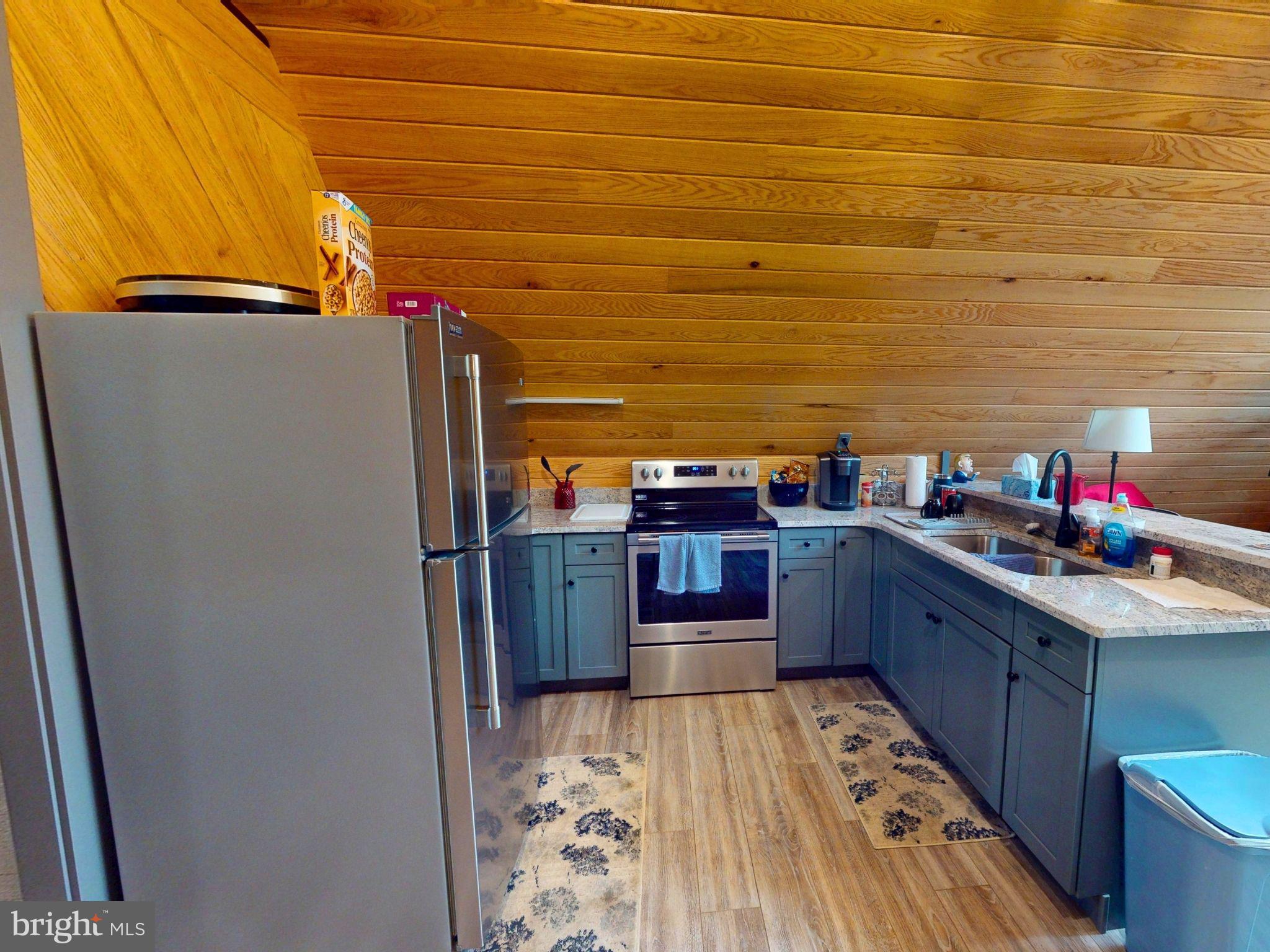 12076 Point Road Huntingdon, PA 16652 - Photo 9 of 13 a kitchen with stainless steel appliances a refrigerator and a stove