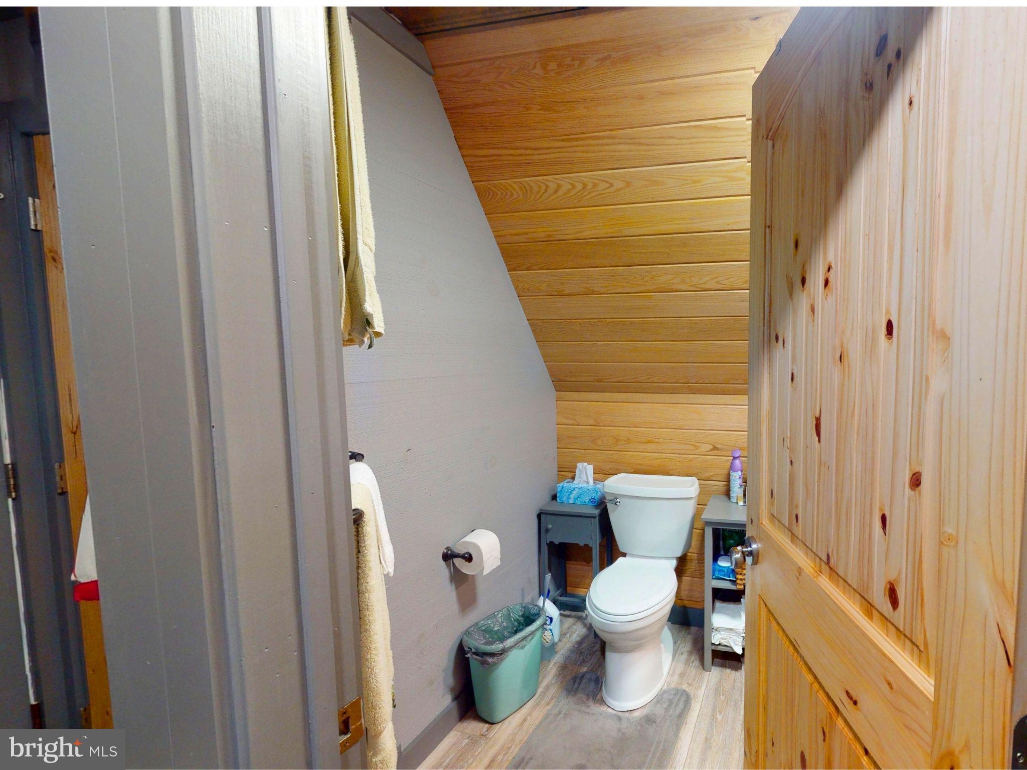 12076 Point Road Huntingdon, PA 16652 - Photo 10 of 13 a bathroom with a toilet and a shower curtain