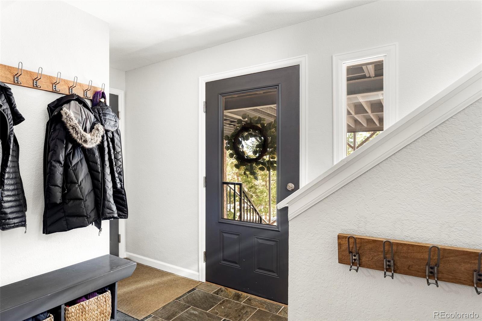 23233 Valley High Road Morrison, CO 80465 - Photo 14 of 43 a view of walk in closet with clothes and shoes