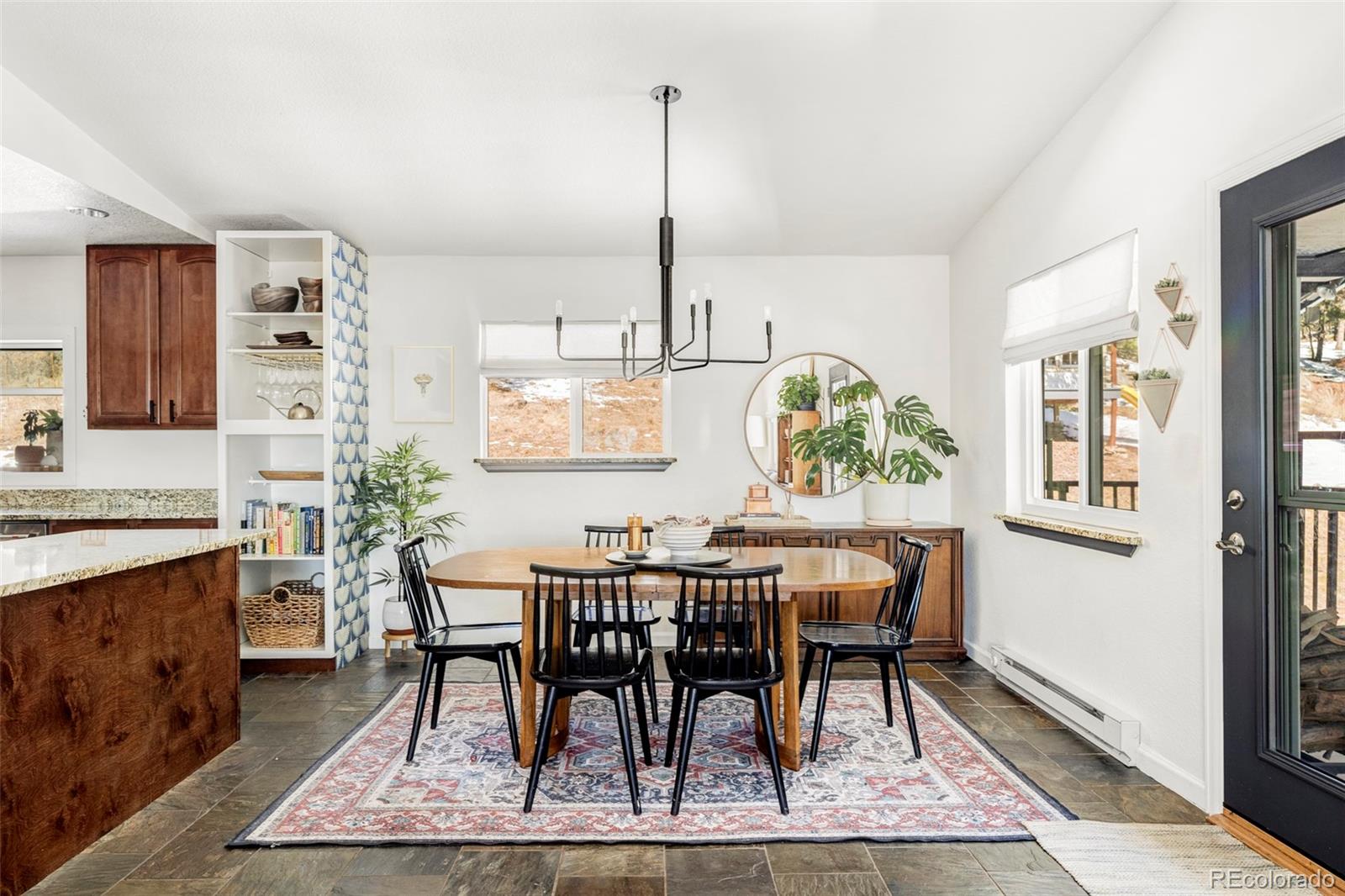 23233 Valley High Road Morrison, CO 80465 - Photo 6 of 43 a view of a dining room with furniture