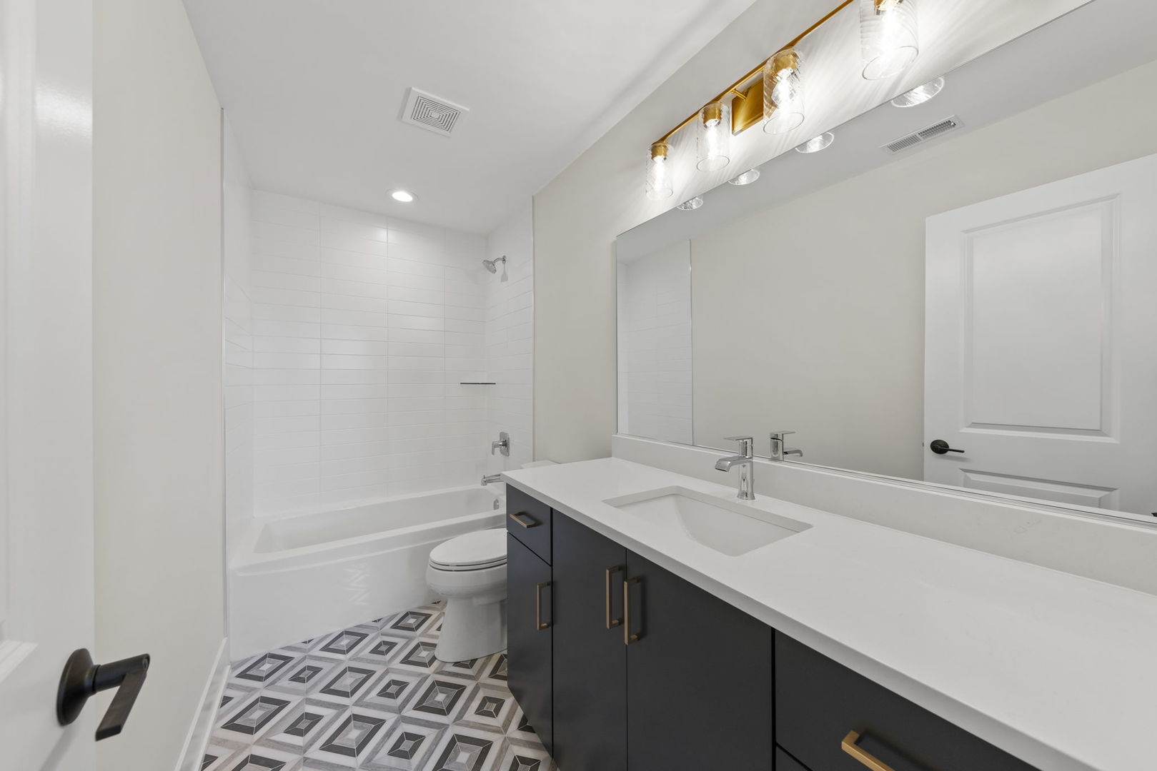 534 McCarthy Street Lemont, IL 60439 - Photo 19 of 23 a bathroom with a sink a toilet a shower and a mirror