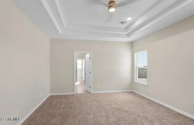 an empty room with a empty space and windows