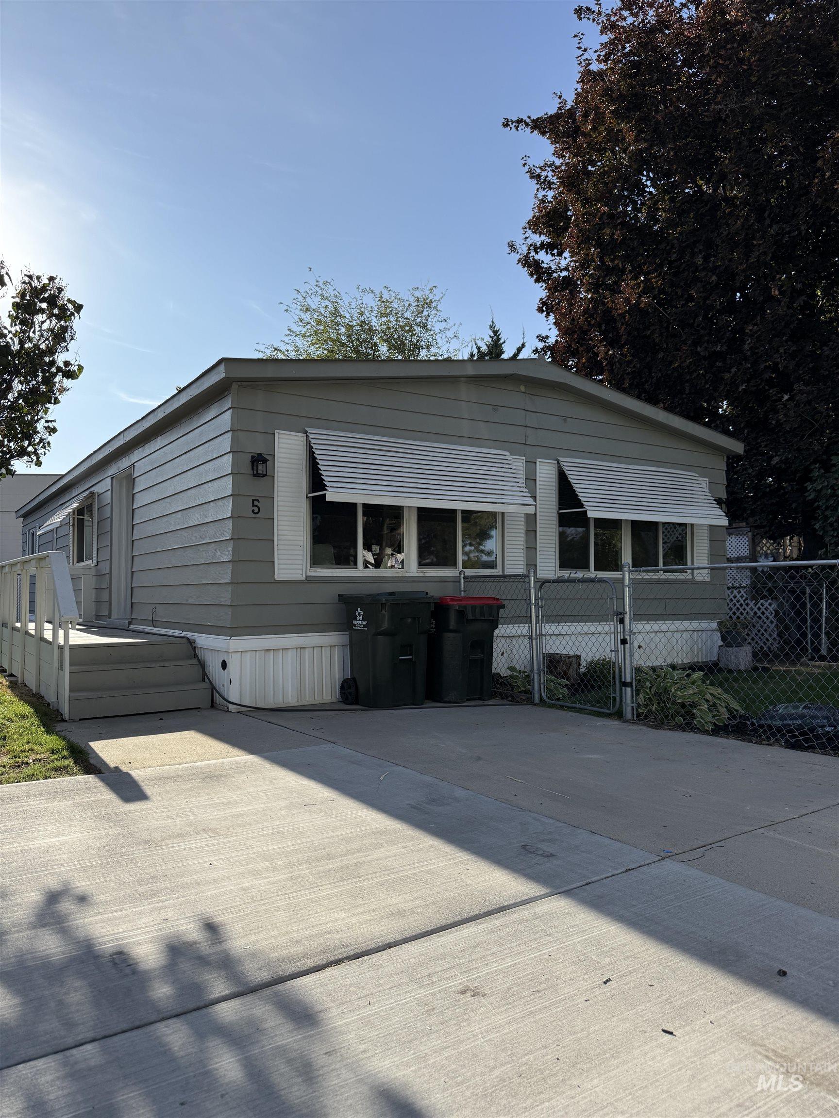 424 West Cherry Lane, Unit 5 Meridian, ID 83642 - Photo 2 of 27 Manufactured / mobile home with a gate