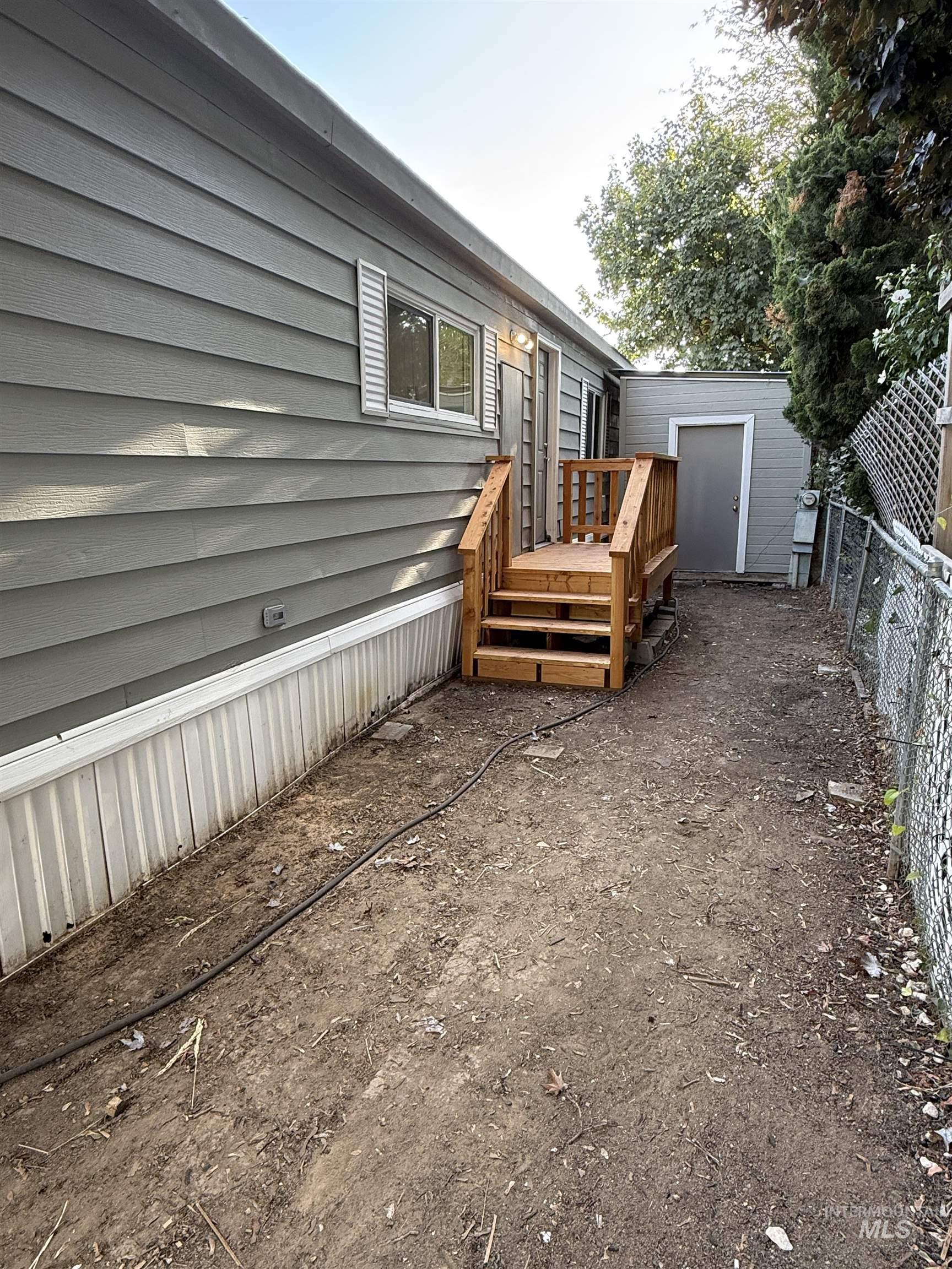 424 West Cherry Lane, Unit 5 Meridian, ID 83642 - Photo 26 of 27 Wooden terrace with a storage shed