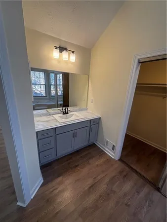 a room with a mirror and a sink
