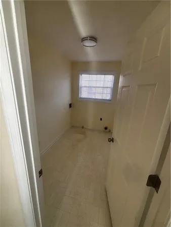 a bathroom with a double vanity sink toilet mirror and shower