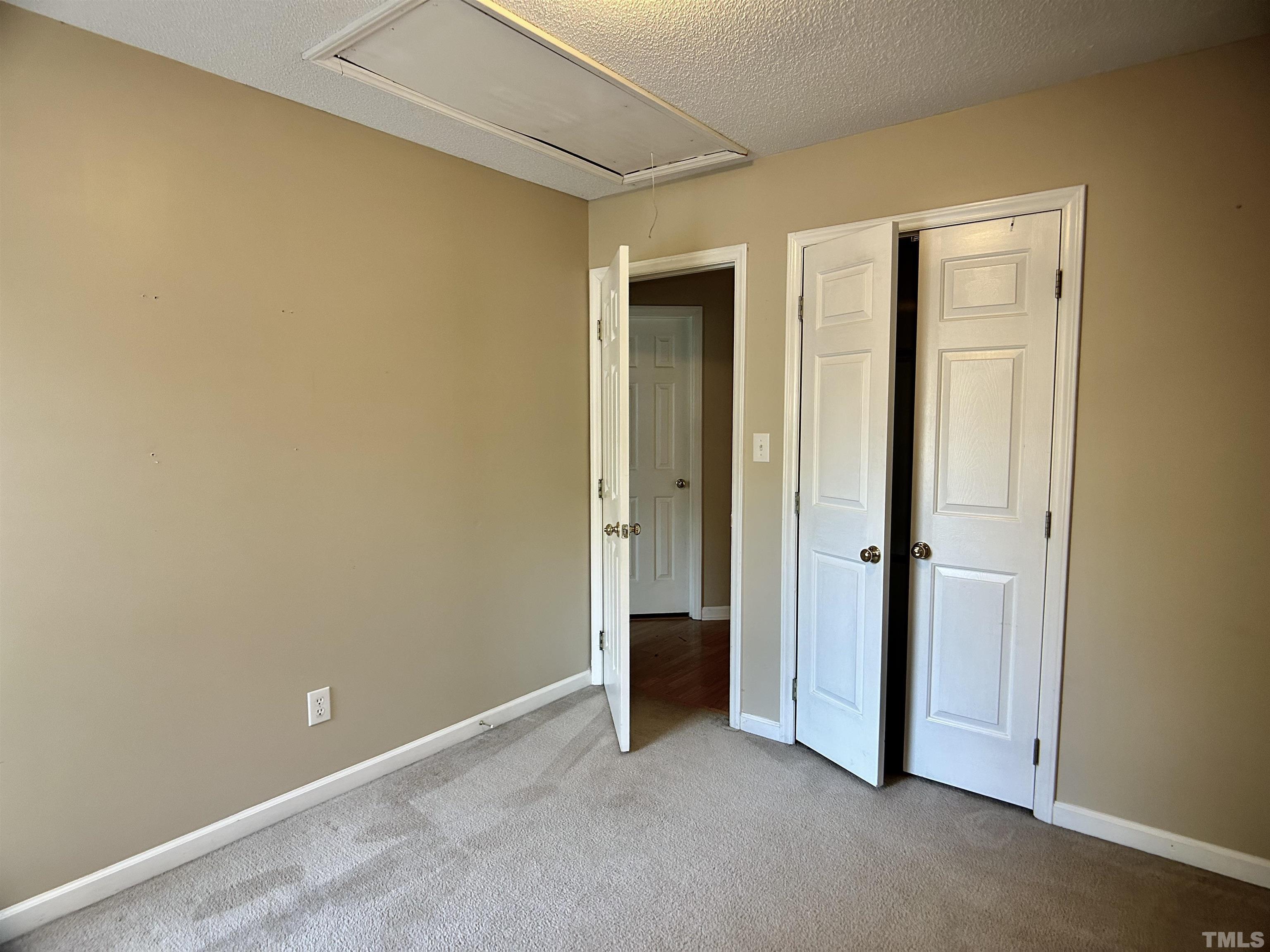316 Amber Lane Willow Spring, NC 27592 - Photo 11 of 18 a view of an empty room with closet and a window
