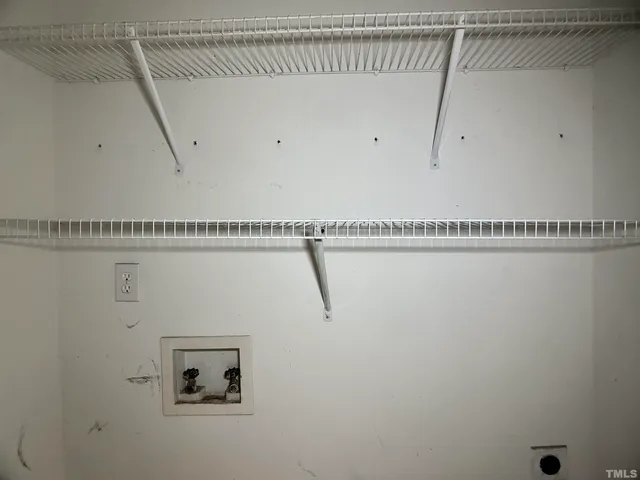 a view of a room with racks on the wall