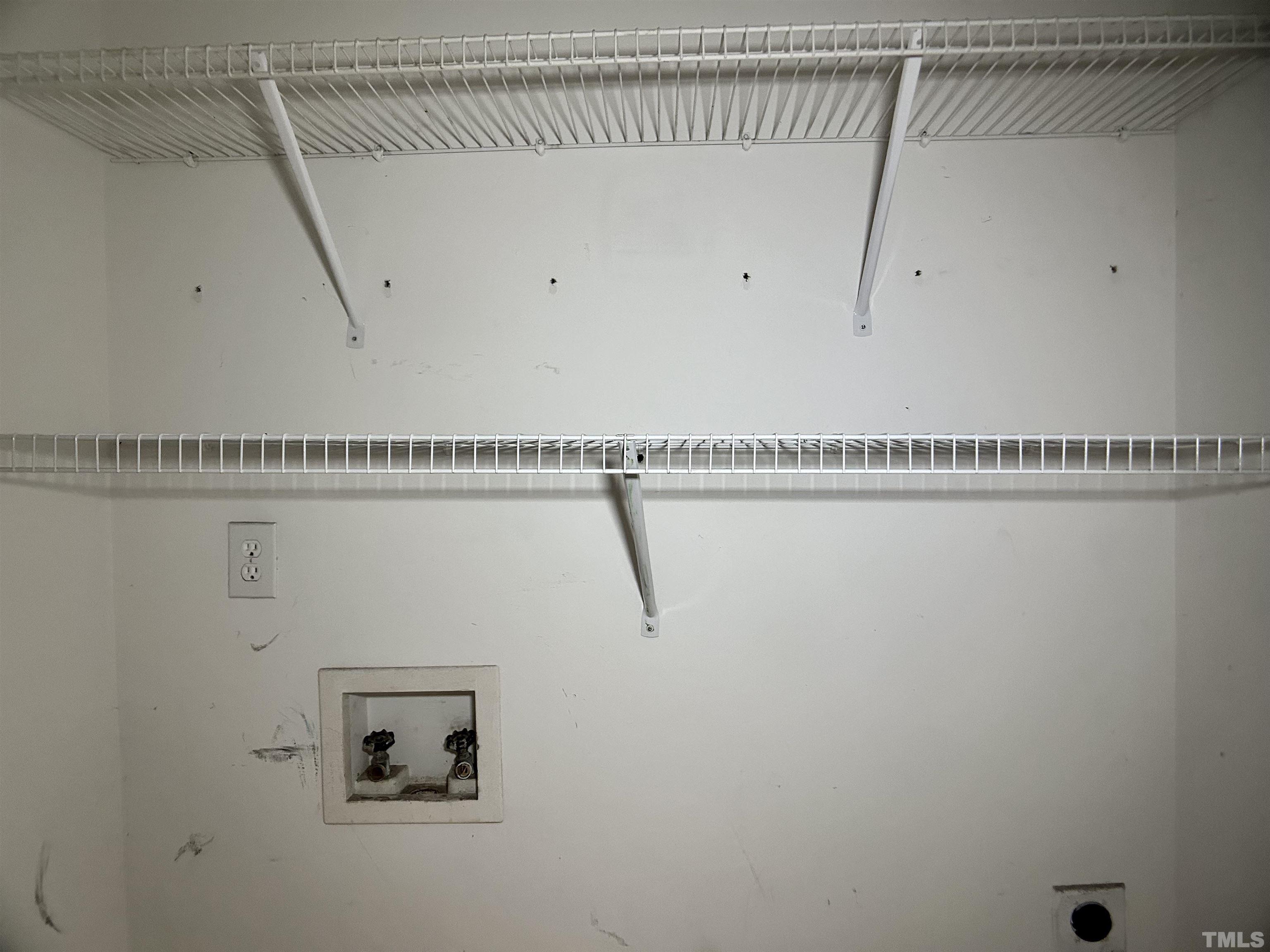 316 Amber Lane Willow Spring, NC 27592 - Photo 14 of 18 a view of a room with racks on the wall