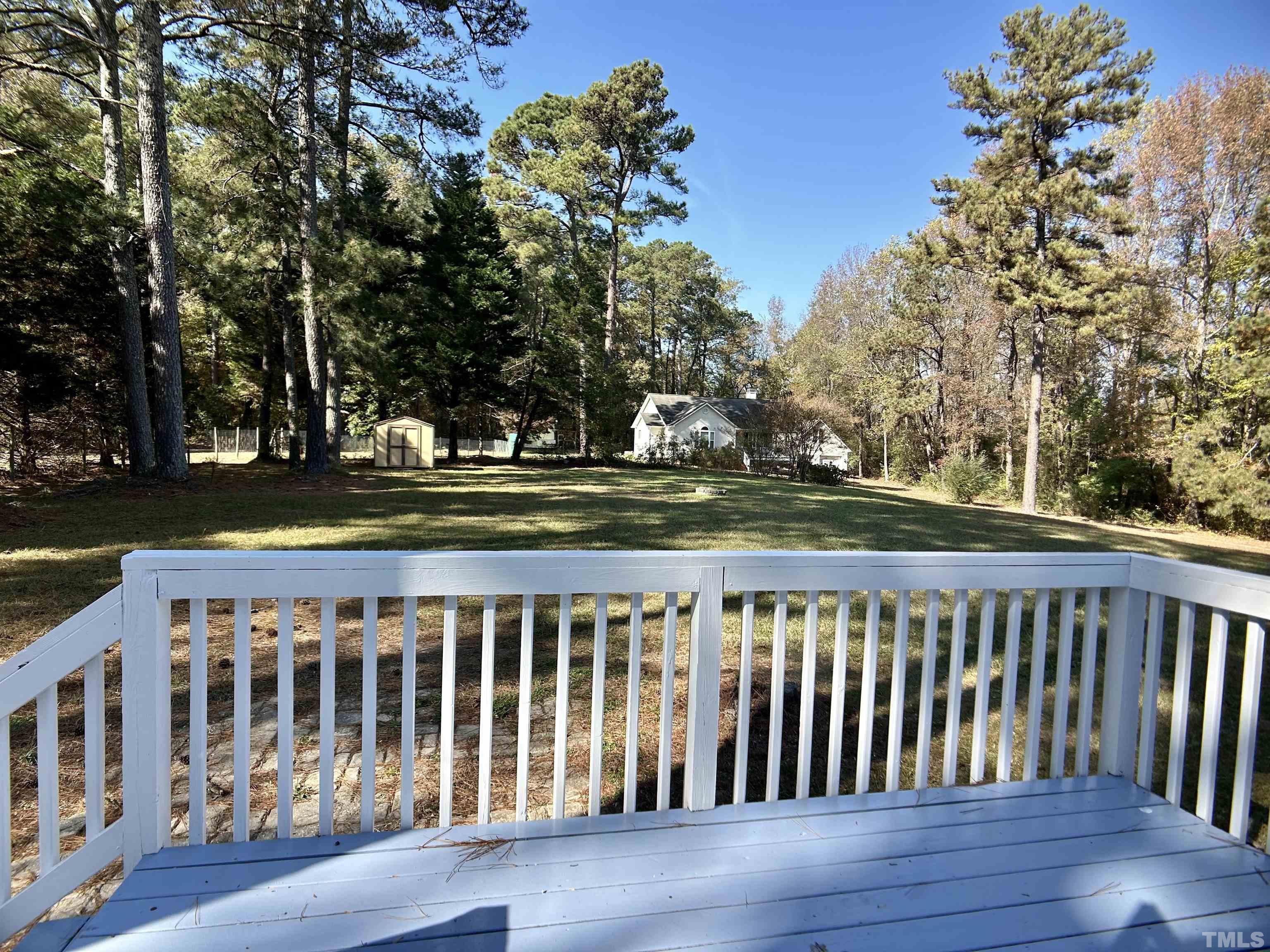 316 Amber Lane Willow Spring, NC 27592 - Photo 15 of 18 a view of a wooden deck