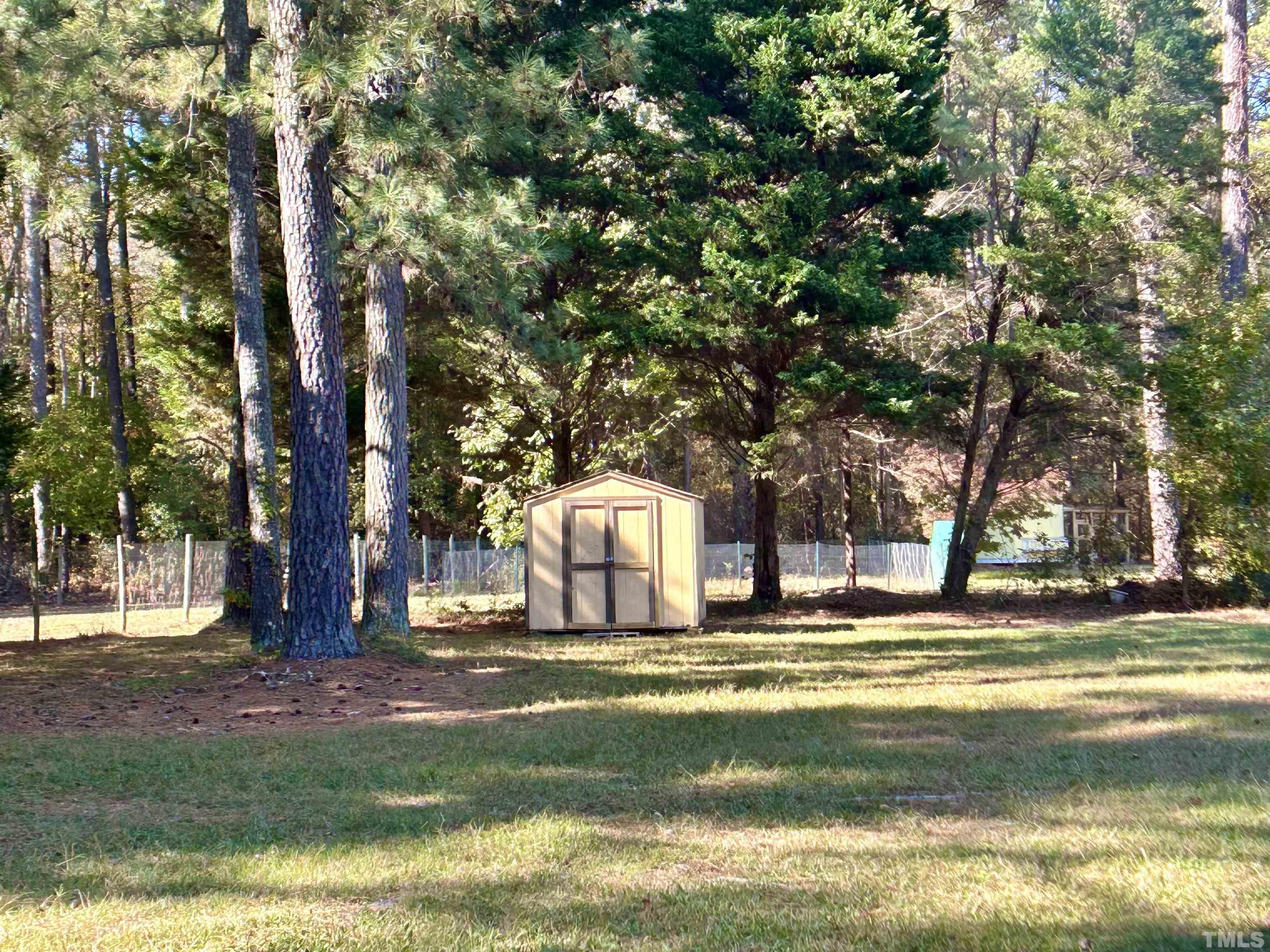 316 Amber Lane Willow Spring, NC 27592 - Photo 16 of 18 a garden view with large trees