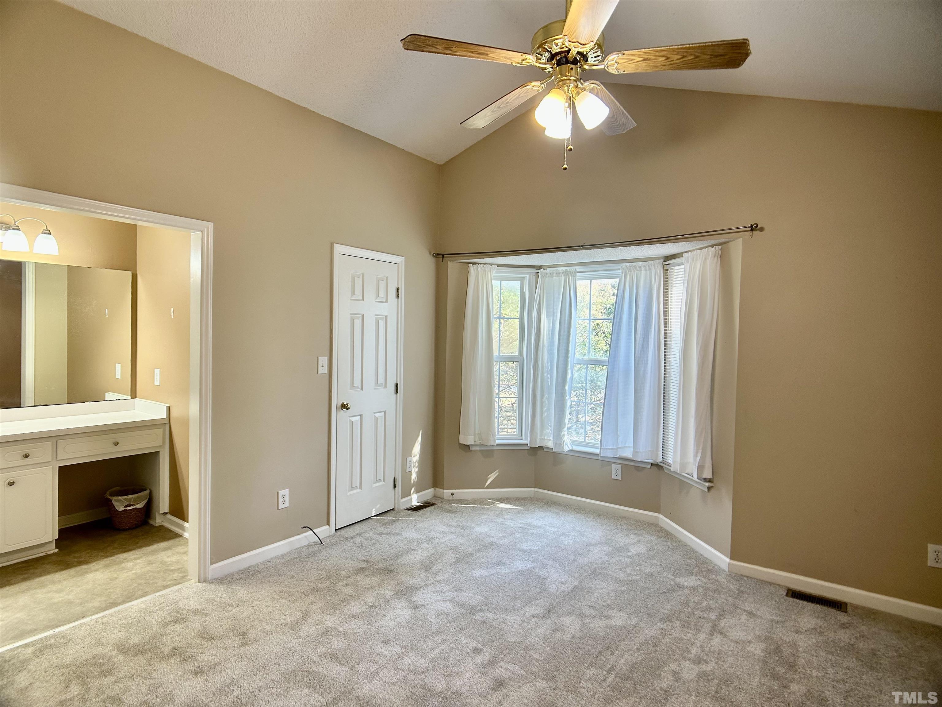 316 Amber Lane Willow Spring, NC 27592 - Photo 6 of 18 an empty room with windows and fan