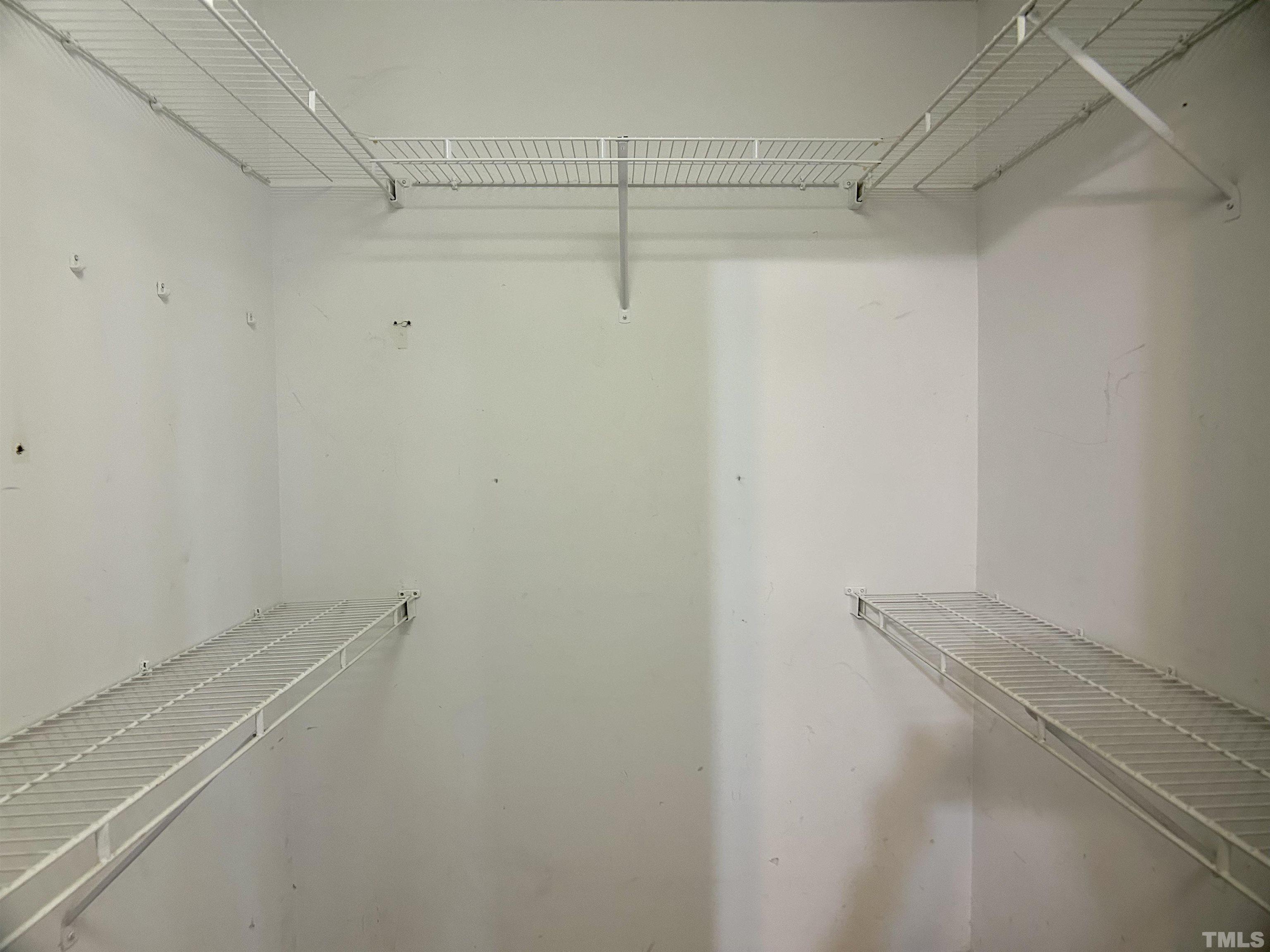 316 Amber Lane Willow Spring, NC 27592 - Photo 7 of 18 a view of a room with racks on the wall