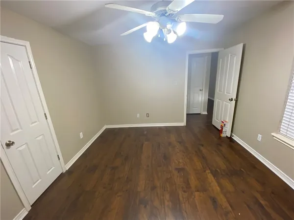 an empty room with wooden floor