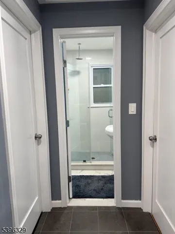 a view of bathroom with shower and tub