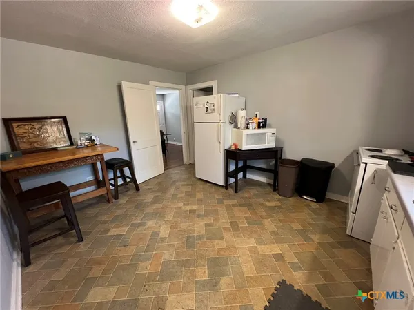 a bed room with furniture and a window