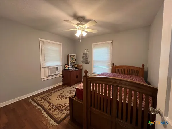 a bed room with furniture and a window