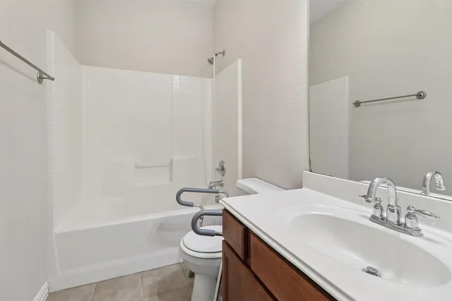 a view of a brick house with a large door and a large window