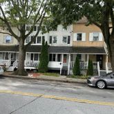 a car parked in front of a house