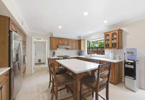 a kitchen with a table and chairs in it