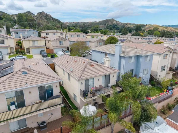 an aerial view of a house with a garden