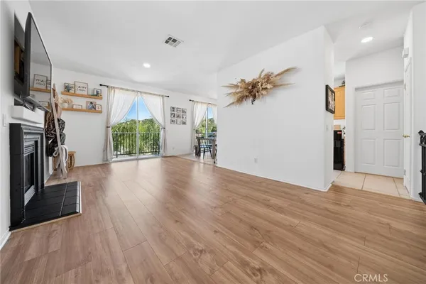 a view of livingroom with hardwood floor and a ceiling fan