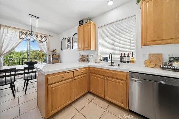 a kitchen with a sink cabinets and window