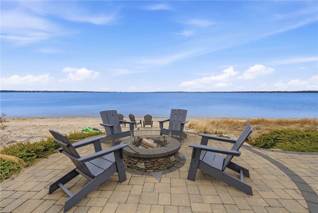 360 Shawomet Avenue Warwick, RI 02889 - Photo 33 of 47 Gorgeous paver patio wtih blue stone accents and fire pit.