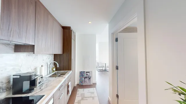 a kitchen with a sink stove and refrigerator