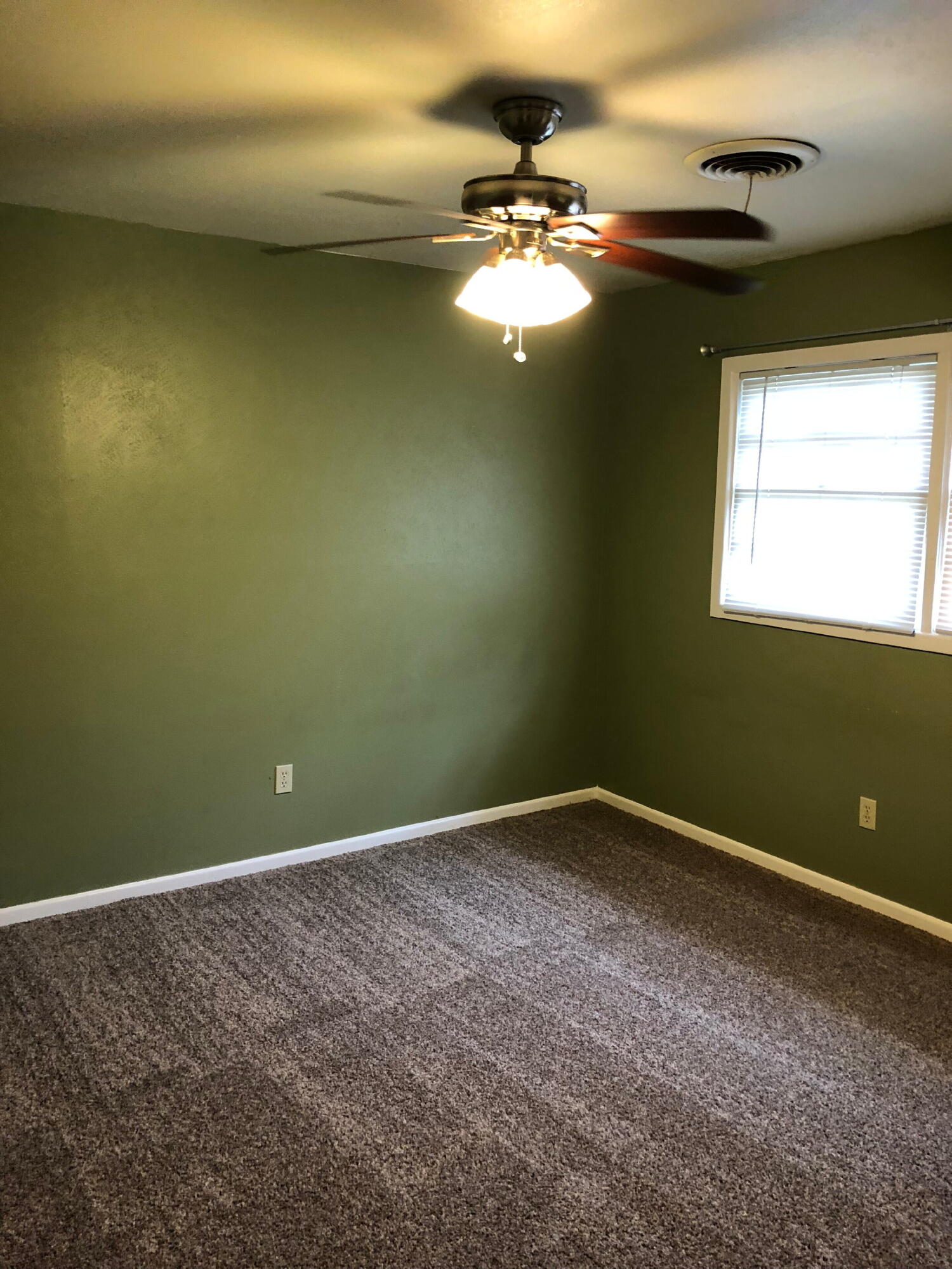 3020 45th Street Lubbock, TX 79413 - Photo 13 of 20 a view of an empty room with a chandelier fan