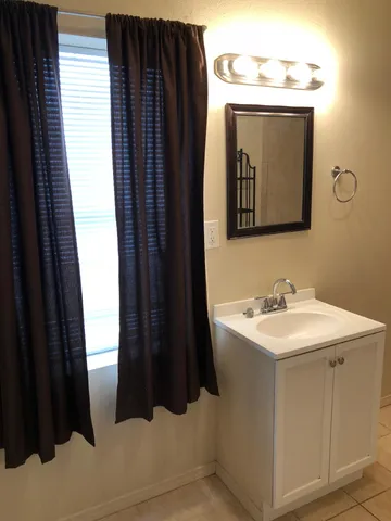 a white toilet sitting next to a bathroom sink