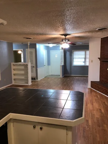 a view of lobby with a hallway and stairs