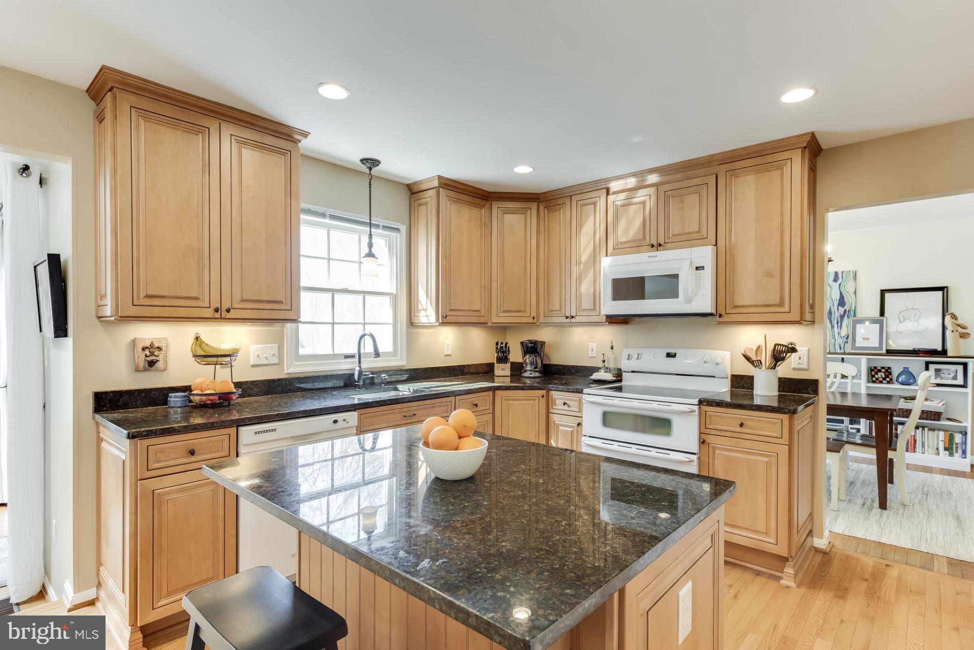 307 Riding Ridge Road Annapolis, MD 21403 - Photo 10 of 36 a kitchen with stainless steel appliances granite countertop a sink stove and microwave