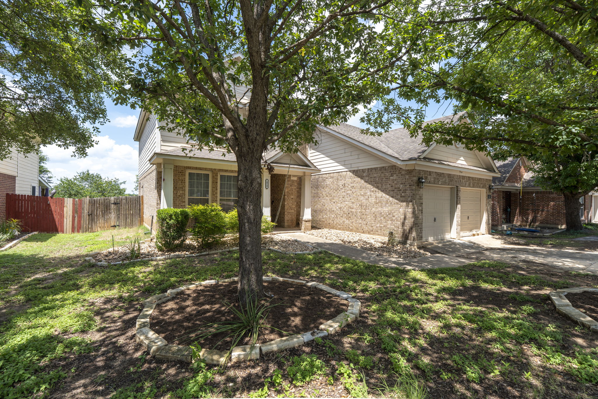 454 Fall Circle Kyle, TX 78640 - Photo 1 of 39 Mature trees and neat landscaping frame this inviting brick and siding residence.