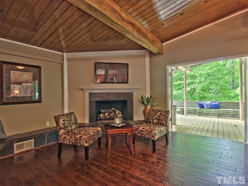 3005 Sandia Drive Raleigh, NC 27607 - Photo 8 of 25 a living room with furniture and a fireplace
