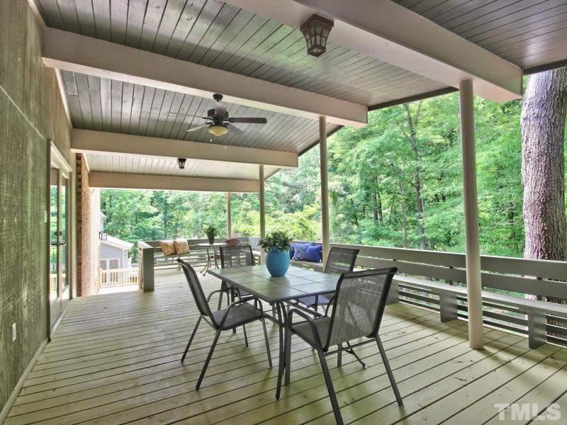 3005 Sandia Drive Raleigh, NC 27607 - Photo 9 of 25 a view of a patio with table and chairs in the patio