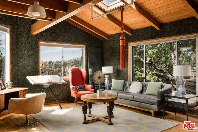 a outdoor living space with furniture and a fireplace