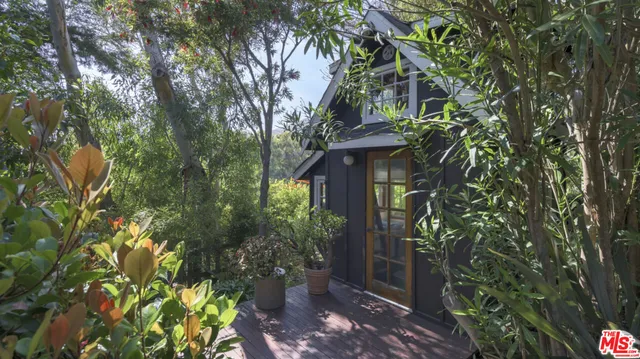 a backyard of a house with lots of green space