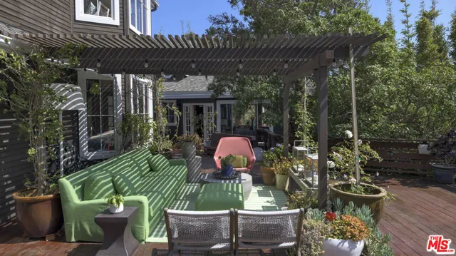 a view of a chairs and table in patio