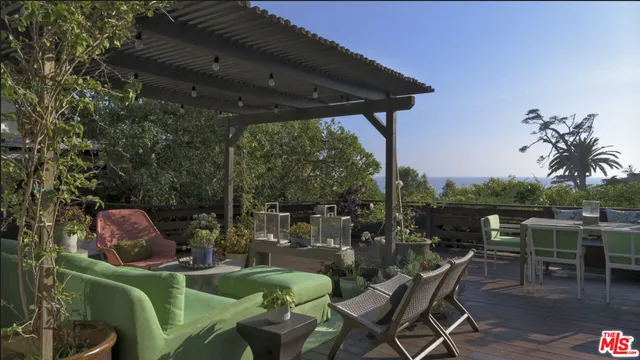 an aerial view of a house with a ocean view