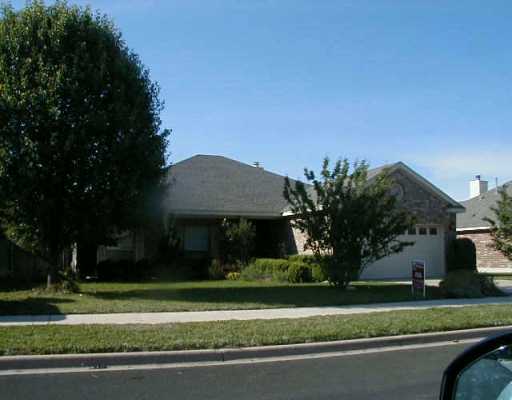 106 River Down Road Georgetown, TX 78628 - Photo 1 of 1 a front view of a house with a yard and potted plants