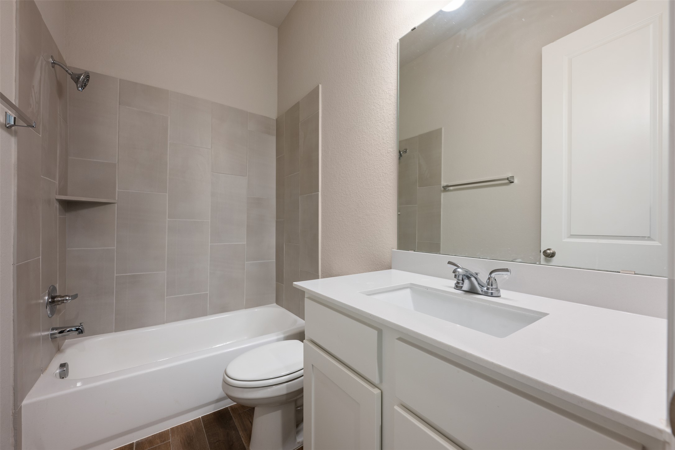 104 Anejo Bluff Georgetown, TX 78628 - Photo 13 of 40 a bathroom with a sink a toilet and shower