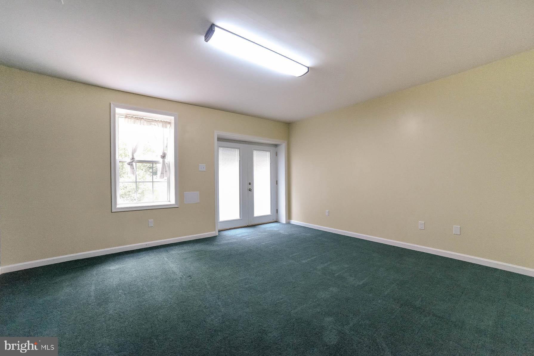 24110 McIntosh Road Hollywood, MD 20636 - Photo 11 of 40 Finished rm in LL with walk out could be 5th BR