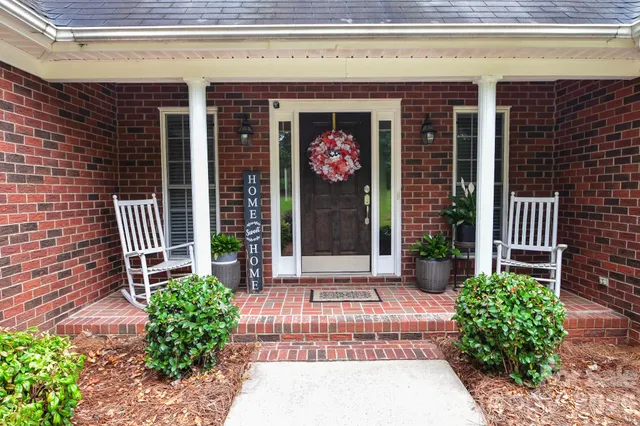 a view of entrance front of house and entertaining space